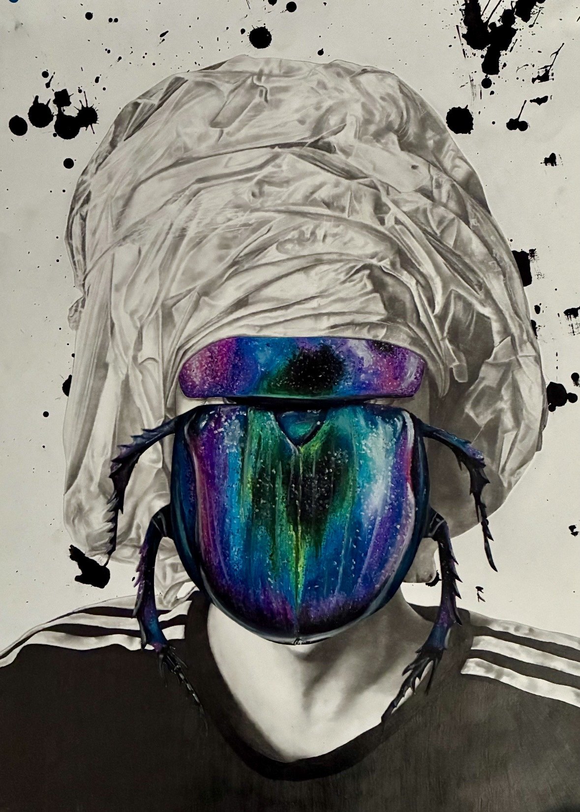 A-Level mixed-media portrait with an iridescent beetle covering the face