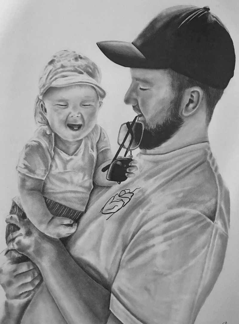 Commissioned graphite family portrait of an adult holding a laughing child